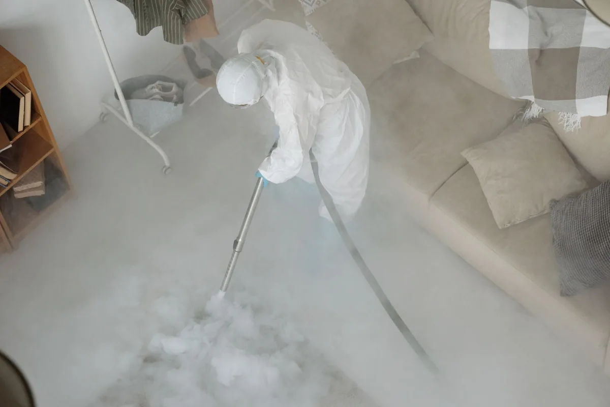 Biohazard cleanup technician in protective equipment, Sioux City, IA